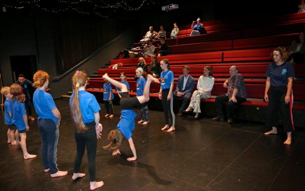 A group of young people take part in a capoeira session with Cheshire Dance at Stiryhouse in Chester as the Duke of Westminster and Olivia Henson look on